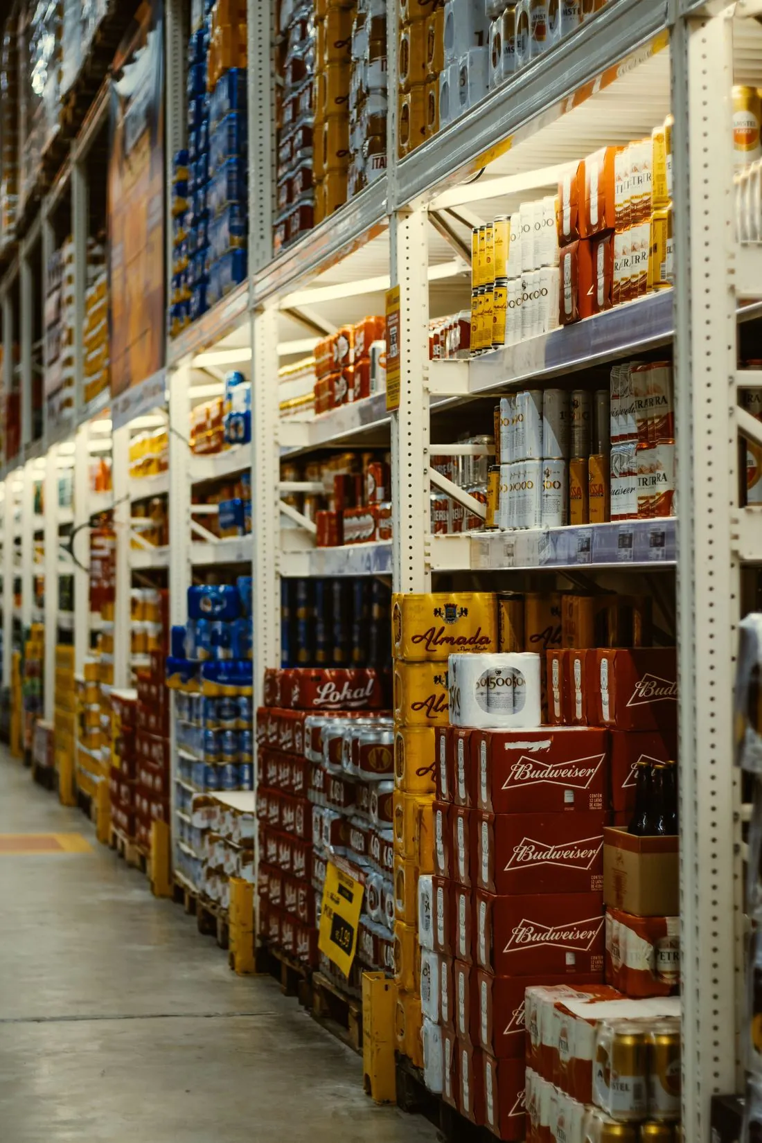 Warehouse shelving stocked with FMCG products distributed by Arete